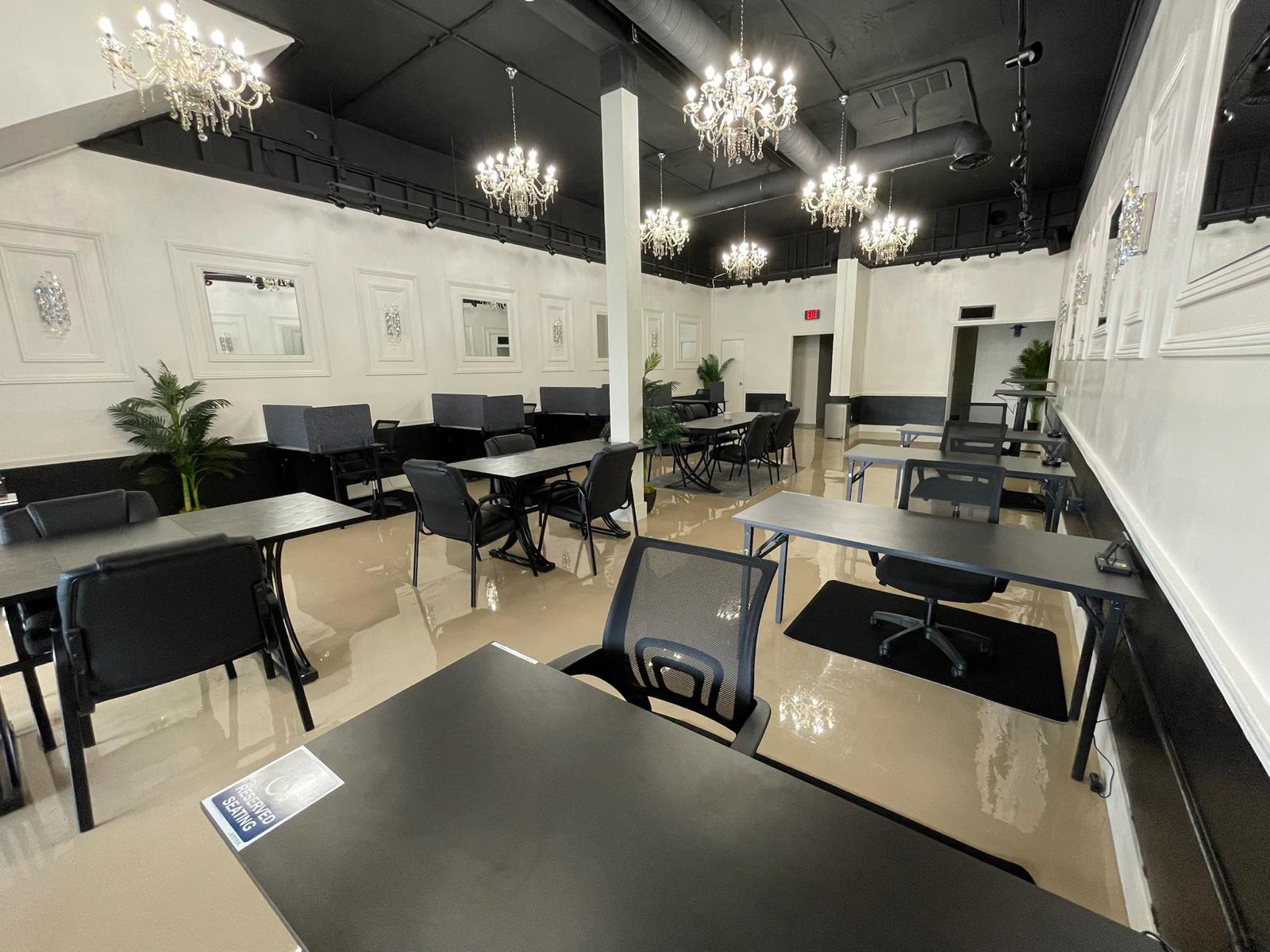 Eventive interior event hall configured with banquet tables and party decor